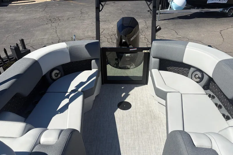 Slide: The Image of 2026 Alera 23Q boat interior with gray seating and Mercury engine. - 14