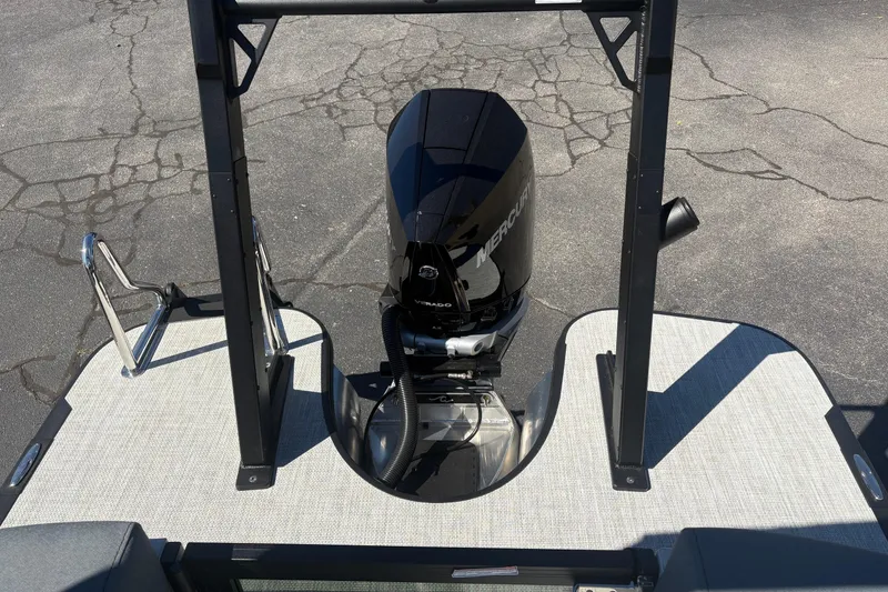 Slide: The Image of Alera 23Q 2026 boat with Mercury outboard motor on a textured deck. - 15