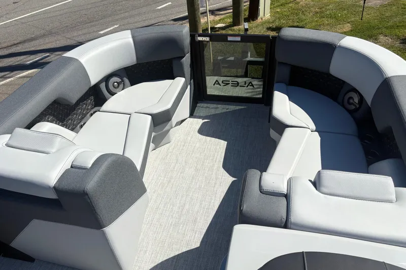 Slide: The Image of 2026 Alera 23Q boat interior with gray seating and modern design. - 5