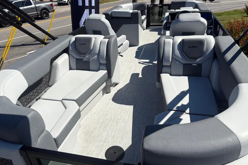 Slide: The Image of Luxurious 2026 Alera 23Q pontoon boat interior with plush seating and modern design. - 7