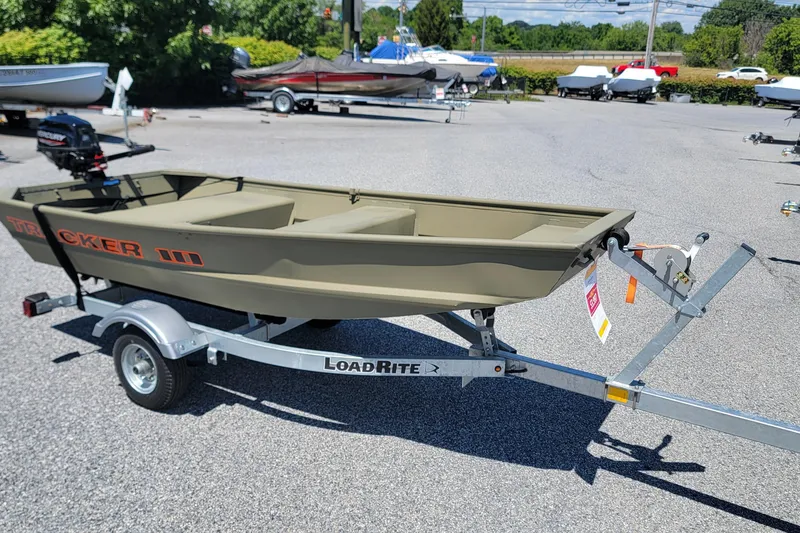 The Image of 2025 Tracker Grizzly 10 Jon boat on LoadRite trailer in outdoor setting. - 0