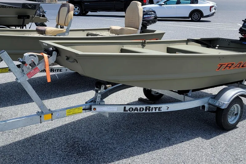The Image of 2025 Tracker Grizzly 10 Jon boat on Load Rite trailer in parking lot. - 1