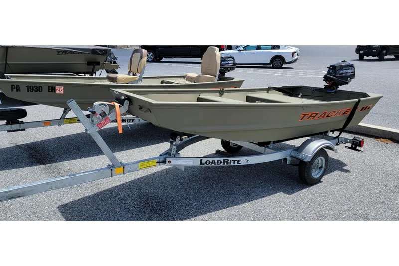 Slide: The Image of 2025 Tracker Grizzly 10 Jon boat on Load Rite trailer in parking lot. - 10