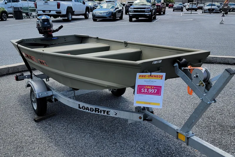 Slide: The Image of 2025 Tracker Grizzly 10 Jon boat on LoadRite trailer, pre-owned, priced at $3,997. - 6