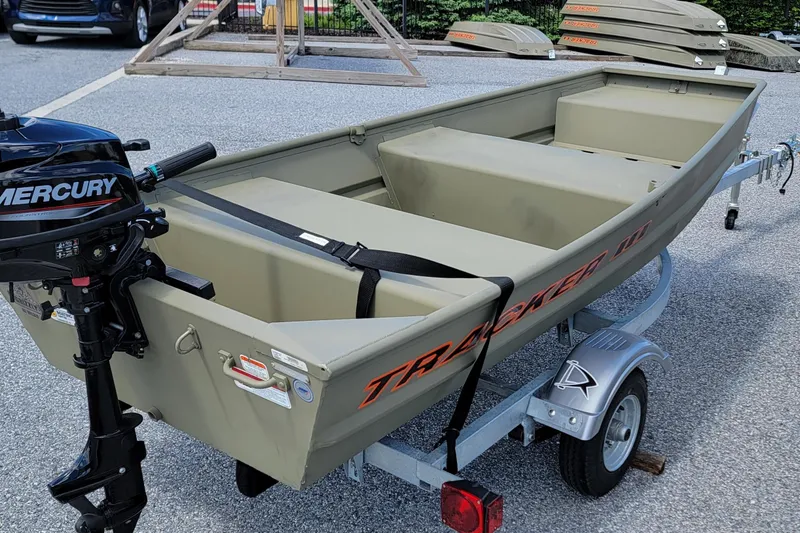 Slide: The Image of 2025 Tracker Grizzly 10 Jon boat on trailer with Mercury outboard motor. - 9