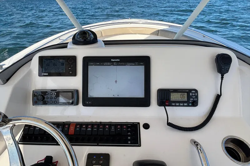 Slide: The Image of Control panel of a 2015 Pursuit S 280 Sport boat with navigation equipment. - 11