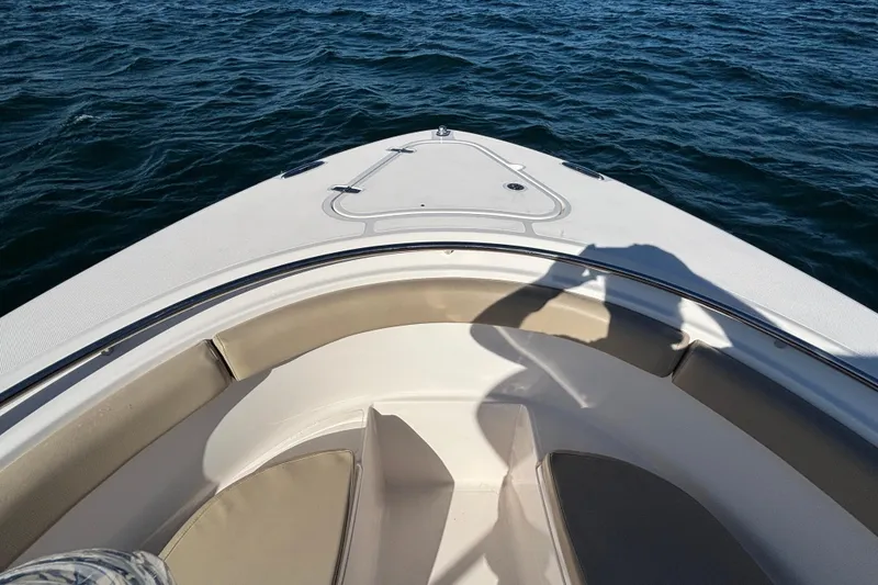 Slide: The Image of Bow view of 2015 Pursuit S 280 Sport boat on open water. - 13