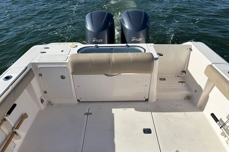 Slide: The Image of 2015 Pursuit S 280 Sport boat deck with twin Yamaha 250 engines. - 19