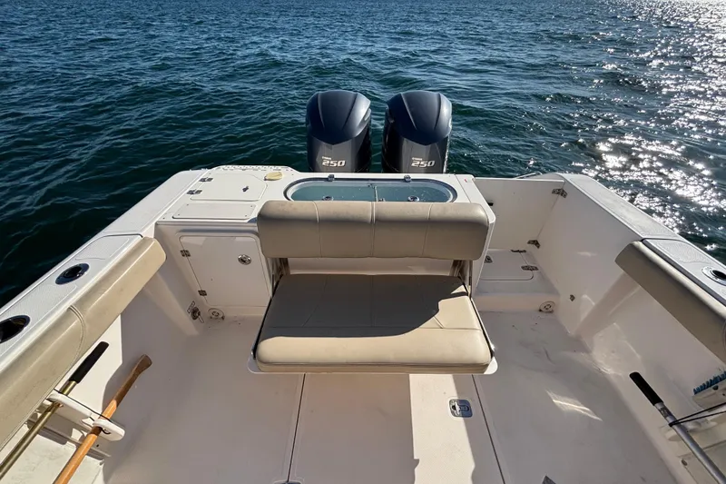 Slide: The Image of 2015 Pursuit S 280 Sport boat with twin engines on open water. - 20