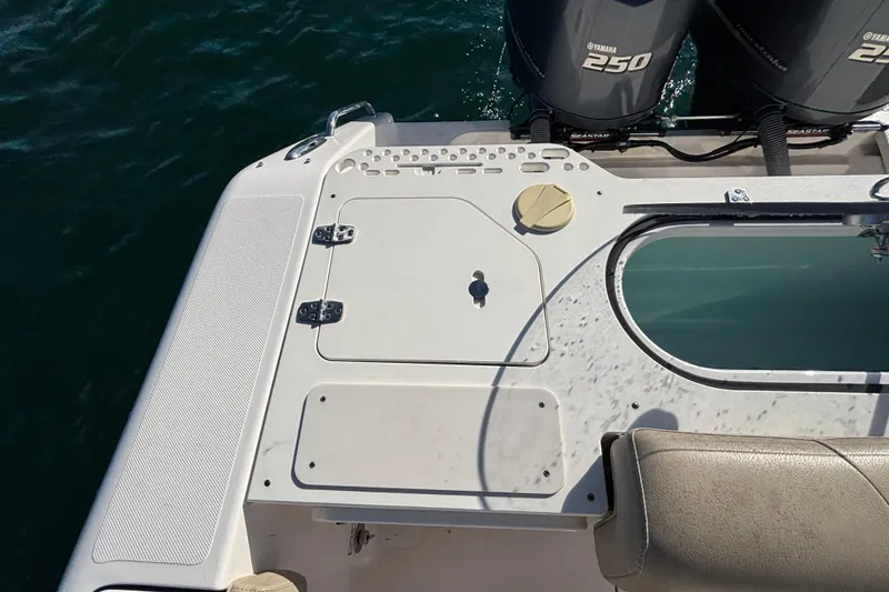 Slide: The Image of 2015 Pursuit S 280 Sport boat deck with Yamaha 250 engines, on water. - 22