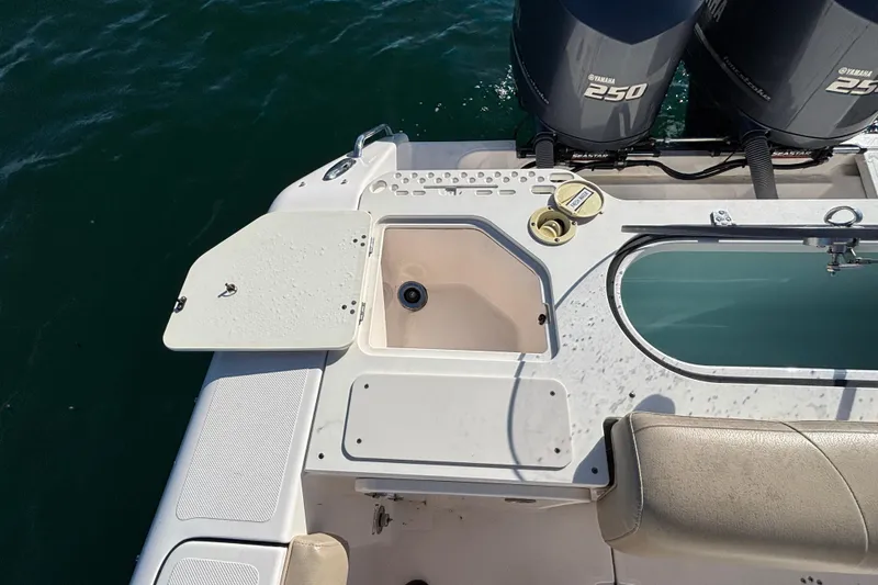 Slide: The Image of 2015 Pursuit S 280 Sport boat deck with Yamaha 250 engines on water. - 23