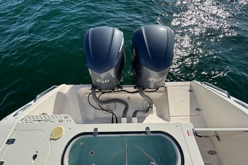Slide: The Image of 2015 Pursuit S 280 Sport boat with twin Yamaha 250 engines on water. - 24