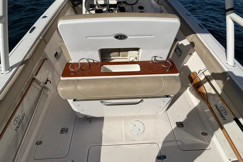 Slide: The Image of 2015 Pursuit S 280 Sport boat interior with seating and cup holders. - 25