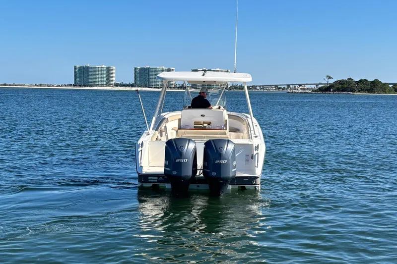 Slide: The Image of 2015 Pursuit S 280 Sport boat on water with twin Yamaha engines. - 4