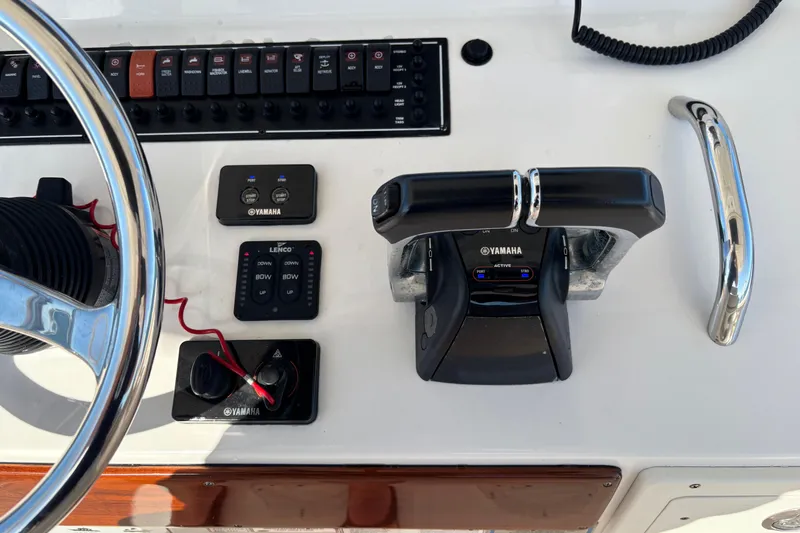 Slide: The Image of Control panel of a 2015 Pursuit S 280 Sport boat with Yamaha throttle. - 9
