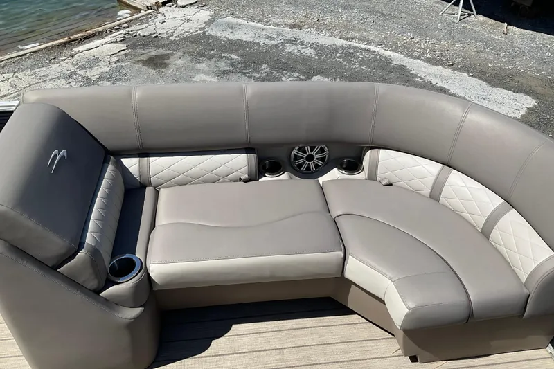 Slide: The Image of Luxurious seating on a 2019 Bennington SX 20 SSRX pontoon boat, featuring elegant upholstery. - 14