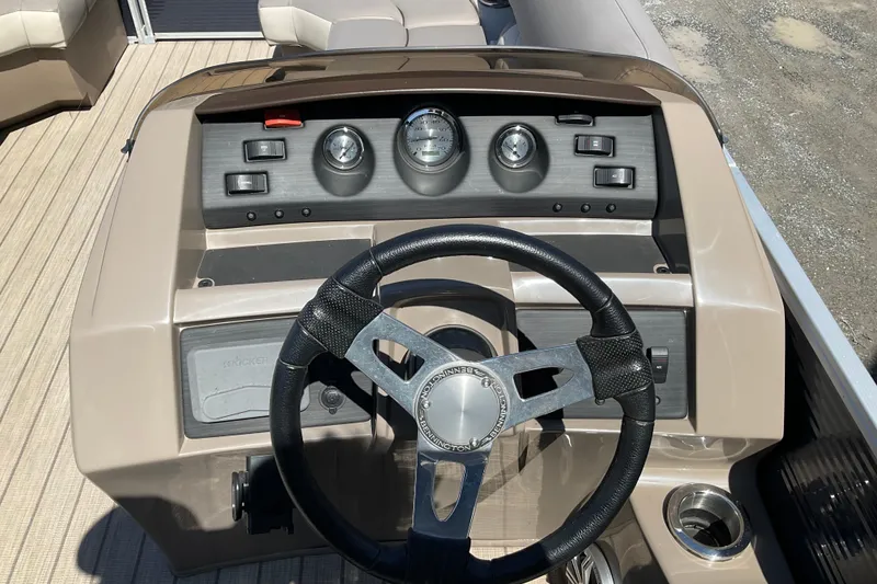 Slide: The Image of 2019 Bennington SX 20 SSRX boat dashboard with steering wheel and gauges. - 15