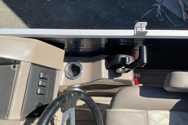 Slide: The Image of 2019 Bennington SX 20 SSRX boat console with steering wheel and control panel. - 16