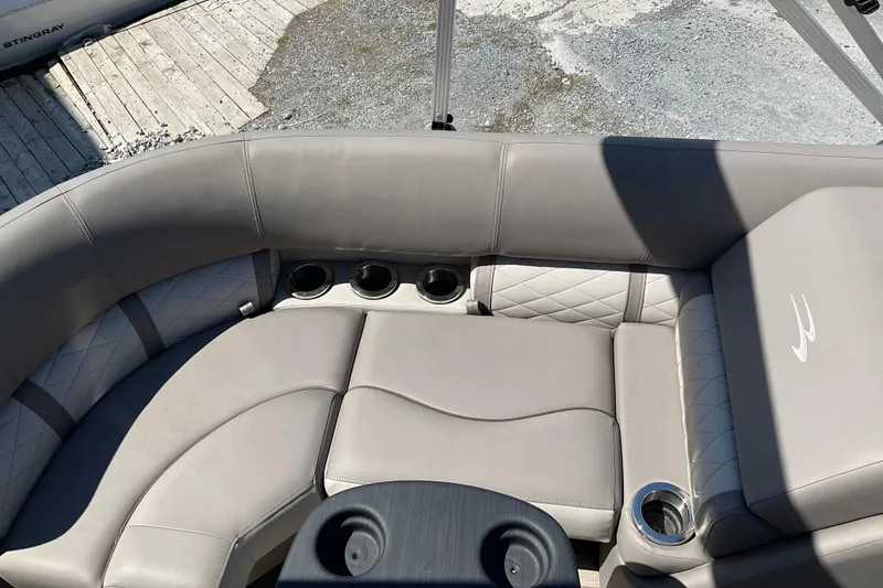 Slide: The Image of 2019 Bennington SX 20 SSRX boat interior with plush seating and cup holders. - 18