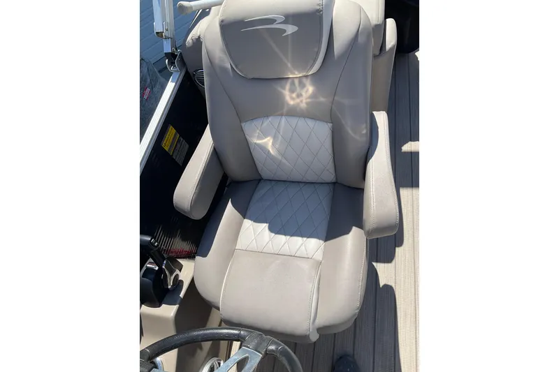 Slide: The Image of Luxurious captain's chair on 2019 Bennington SX 20 SSRX pontoon boat, featuring quilted upholstery. - 30