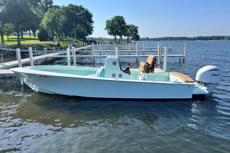 The Image of 2007 Speed Sport 25 boat docked on a serene lake with Yamaha outboard motor. - 1
