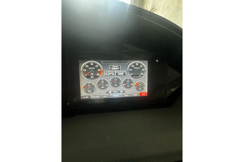 Slide: The Image of Dashboard display of a 2019 Cobalt 25SC boat showing various gauges and readings. - 10