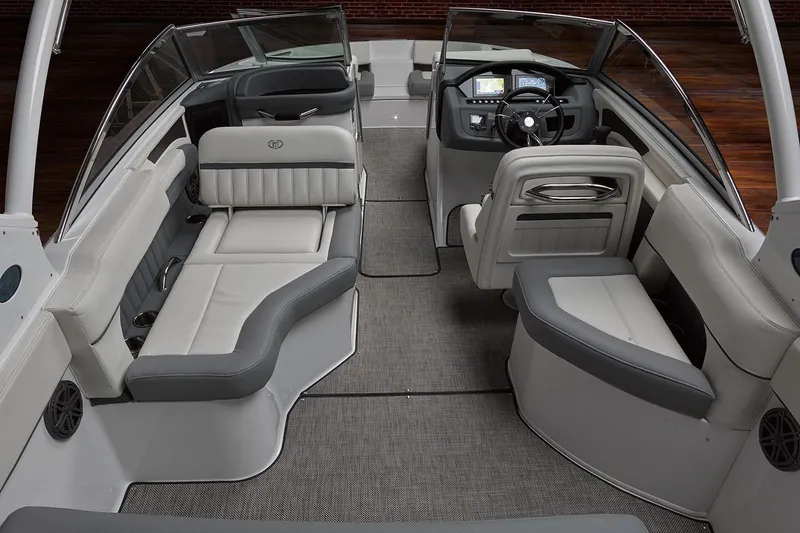 Slide: The Image of Manufacturer Provided Image: 2019 Cobalt 25SC boat interior with gray and white seating, modern dashboard. - 5