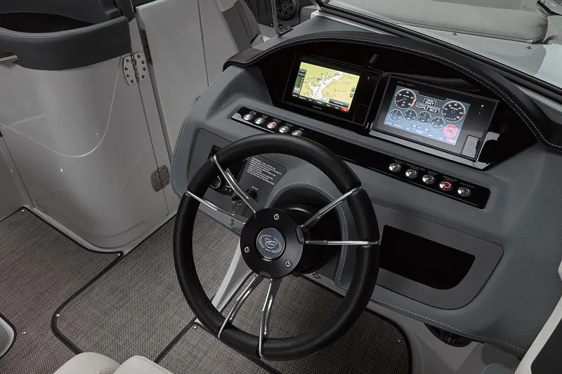 Slide: The Image of Manufacturer Provided Image: 2019 Cobalt 25SC boat dashboard with steering wheel and navigation screens. - 6