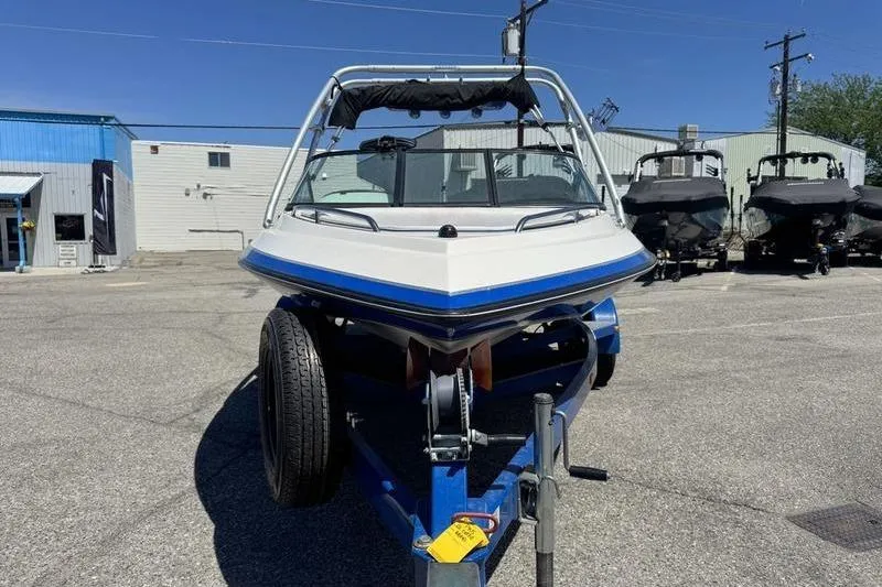 Slide: The Image of 2002 Gekko GTR-22 boat on trailer in industrial lot. - 12