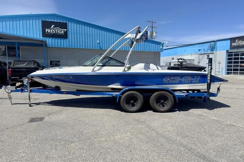 The Image of 2002 Gekko GTR-22 boat on trailer outside Prestige dealership. - 2