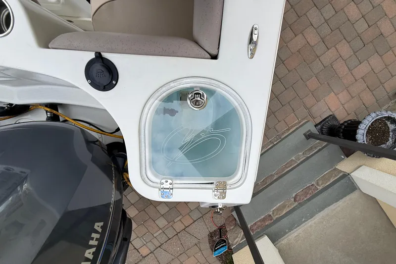 Slide: The Image of 2012 Sailfish 2680 WAC boat with Yamaha engine, featuring a livewell and seating area. - 16