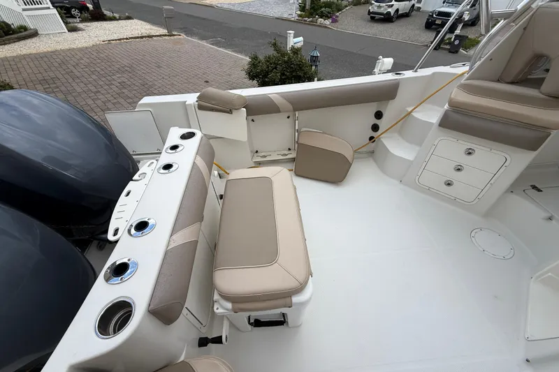 Slide: The Image of 2012 Sailfish 2680 WAC boat interior with seating and storage compartments. - 17