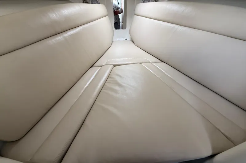 Slide: The Image of Interior cabin view of 2012 Sailfish 2680 WAC with beige cushioned seating. - 30
