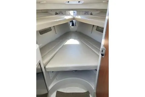 Slide: The Image of 2012 Sailfish 2680 WAC cabin interior with cushioned seating and storage. - 8