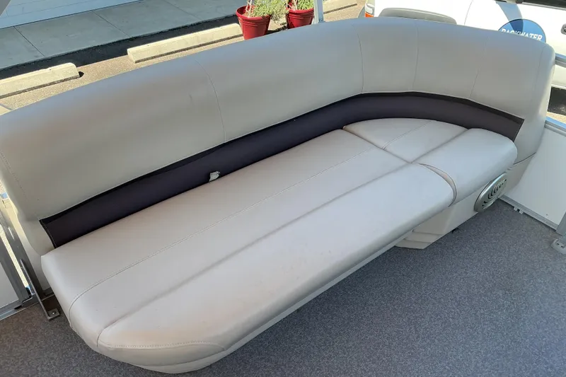 Slide: The Image of 2017 Sun Tracker Party Barge 24 DLX interior seating with beige upholstery. - 12