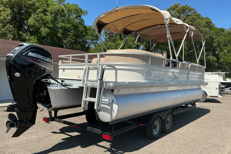 Slide: The Image of 2017 Sun Tracker Party Barge 24 DLX pontoon boat with Mercury outboard engine on trailer. - 6