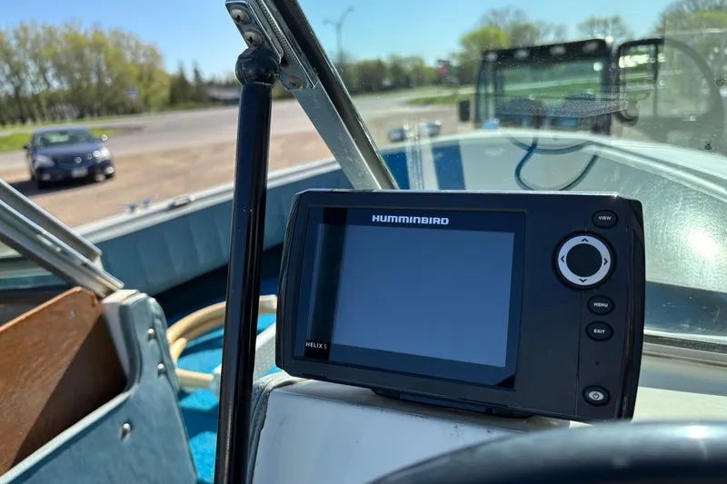 Slide: The Image of 1983 Crestliner 16 boat interior with Humminbird Helix 5 fish finder on dashboard. - 8