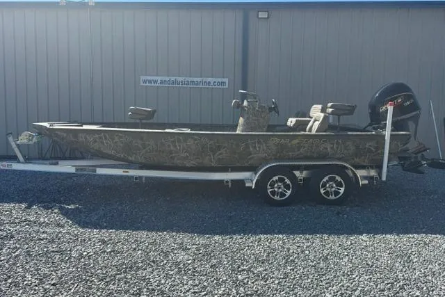 Slide: The Image of 2026 War Eagle 2170 Blackhawk boat on trailer, parked outside Andalusia Marine. - 6