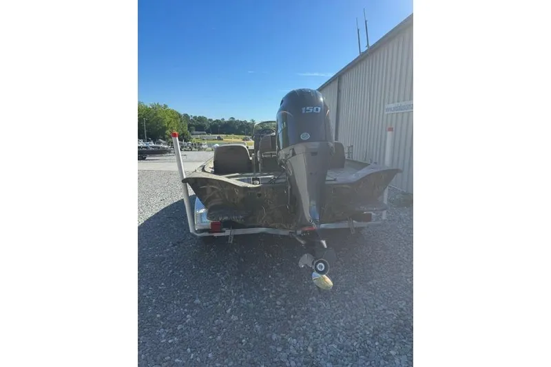 Slide: The Image of 2026 War Eagle 2170 Blackhawk boat with 150 HP motor on a trailer. - 7