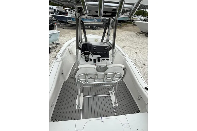 Slide: The Image of 2016 Tidewater 210 LXF boat interior with steering console and seating. - 3