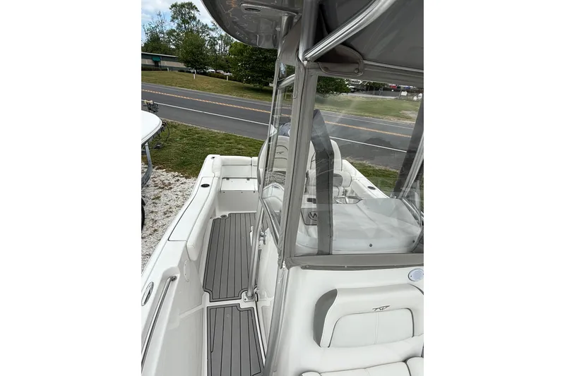 Slide: The Image of 2016 Tidewater 210 LXF boat with sleek design and comfortable seating. - 6