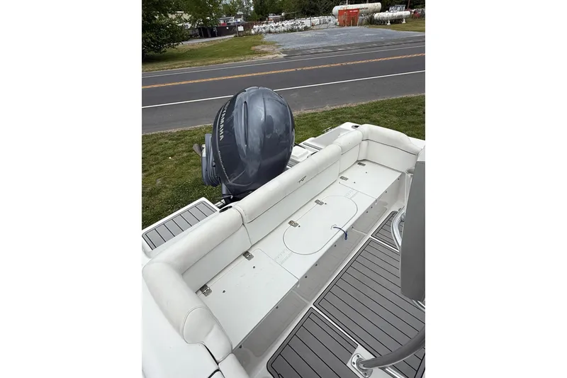 Slide: The Image of 2016 Tidewater 210 LXF boat with Yamaha outboard motor, featuring spacious seating and deck. - 8