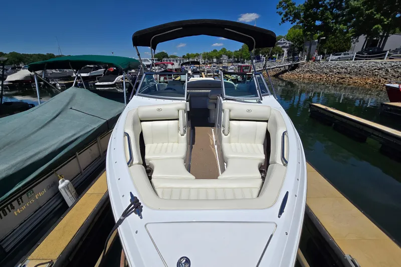 Slide: The Image of 2016 Cobalt R3 boat docked, featuring white seating and a black canopy. - 10