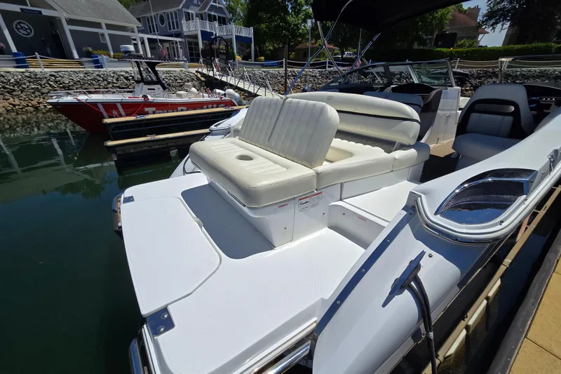Slide: The Image of 2016 Cobalt R3 boat docked, featuring white seating and sleek design. - 15