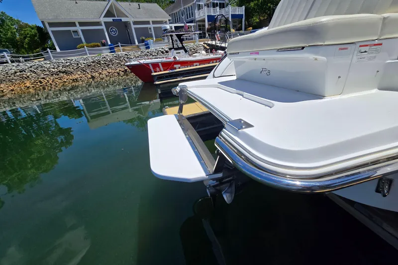 Slide: The Image of 2016 Cobalt R3 boat docked at marina with swim platform visible. - 17