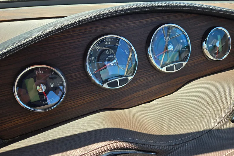 Slide: The Image of Dashboard of 2016 Cobalt R3 with wood finish and analog gauges. - 18