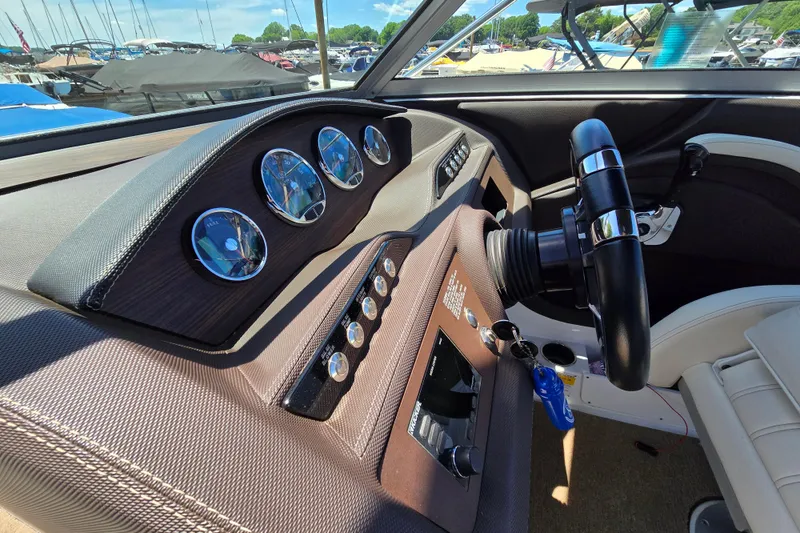 Slide: The Image of Interior dashboard of a 2016 Cobalt R3 boat with gauges and steering wheel. - 19