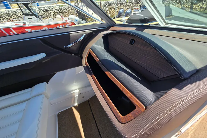 Slide: The Image of Interior view of a 2016 Cobalt R3 boat, featuring sleek design and wood accents. - 20