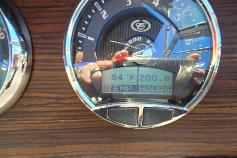 Slide: The Image of Close-up of 2016 Cobalt R3 dashboard gauge displaying 64°F and 200.6 hours. - 21