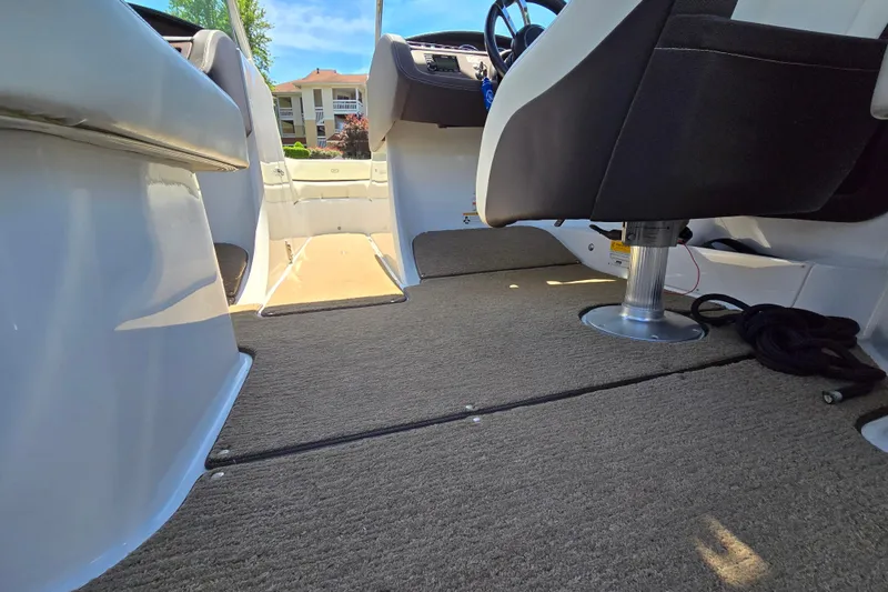 Slide: The Image of Interior view of a 2016 Cobalt R3 boat with carpeted flooring and seating. - 25